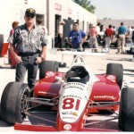 Jim standing next to INDY car 81 / driver Billy Vucovich III